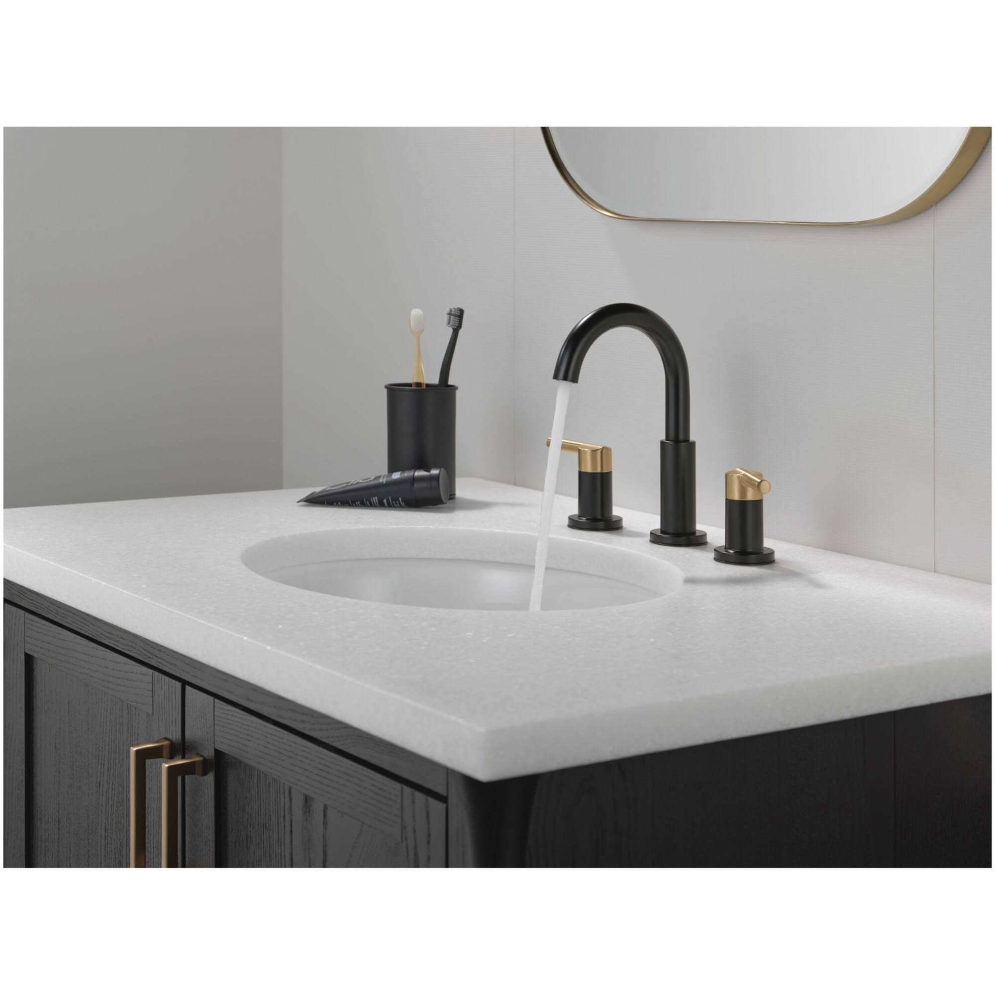 007f4e0772b95fb7e0f87a2a0472818e3d440578ded8a1bb9061741045c822c3.jpg Delta Nicoli Two Handle Widespread Bathroom Faucet 35749LF Matte Black / Champagne Bronze - Image 1