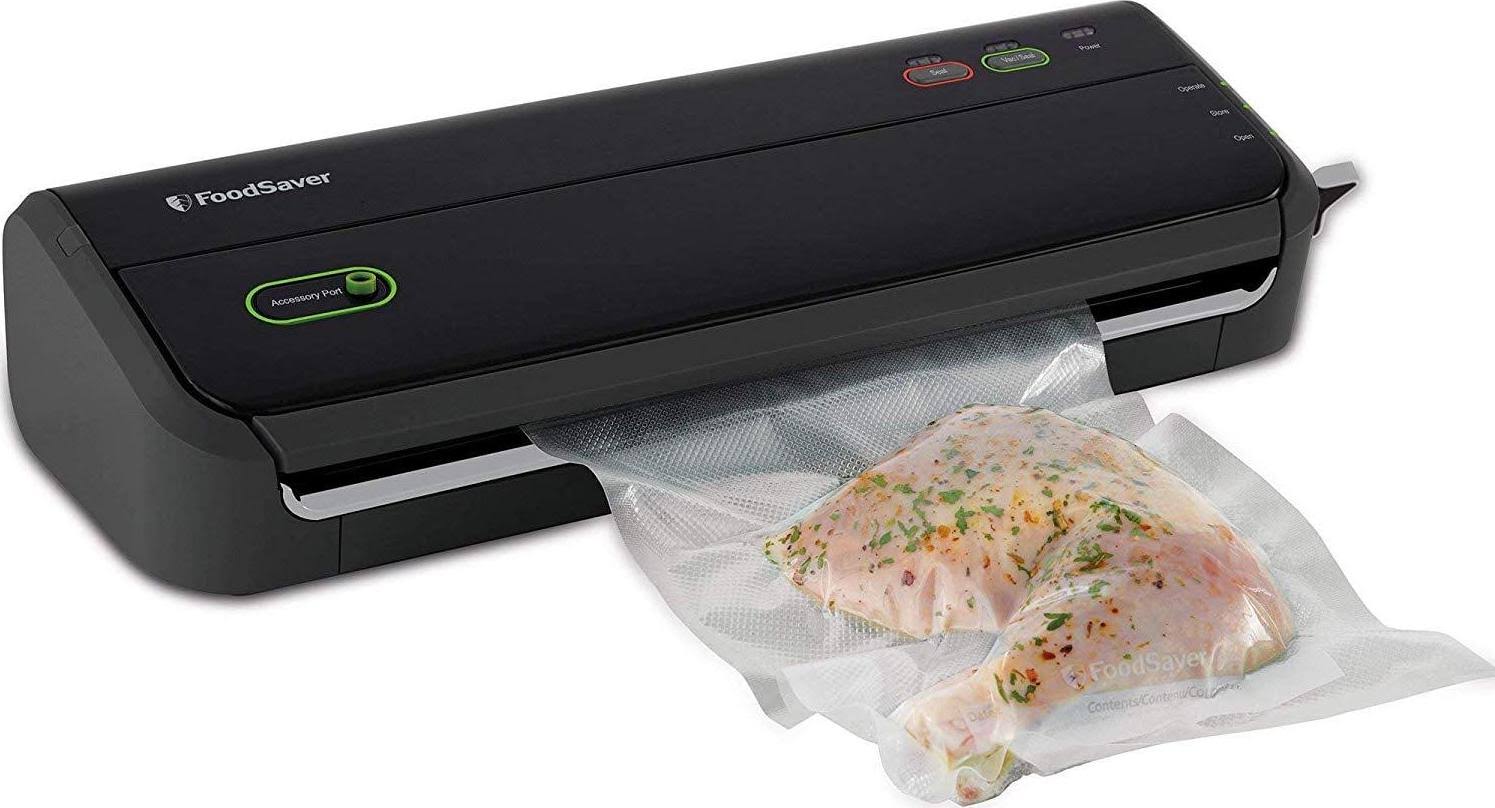 0d42f158151fdd839f3643d1278206ee25c1ea332ac6ad73b0e29108117eedda.jpg Foodsaver FM2000 Vacuum Sealer Machine with Starter Bags Rolls - Black - Image 1