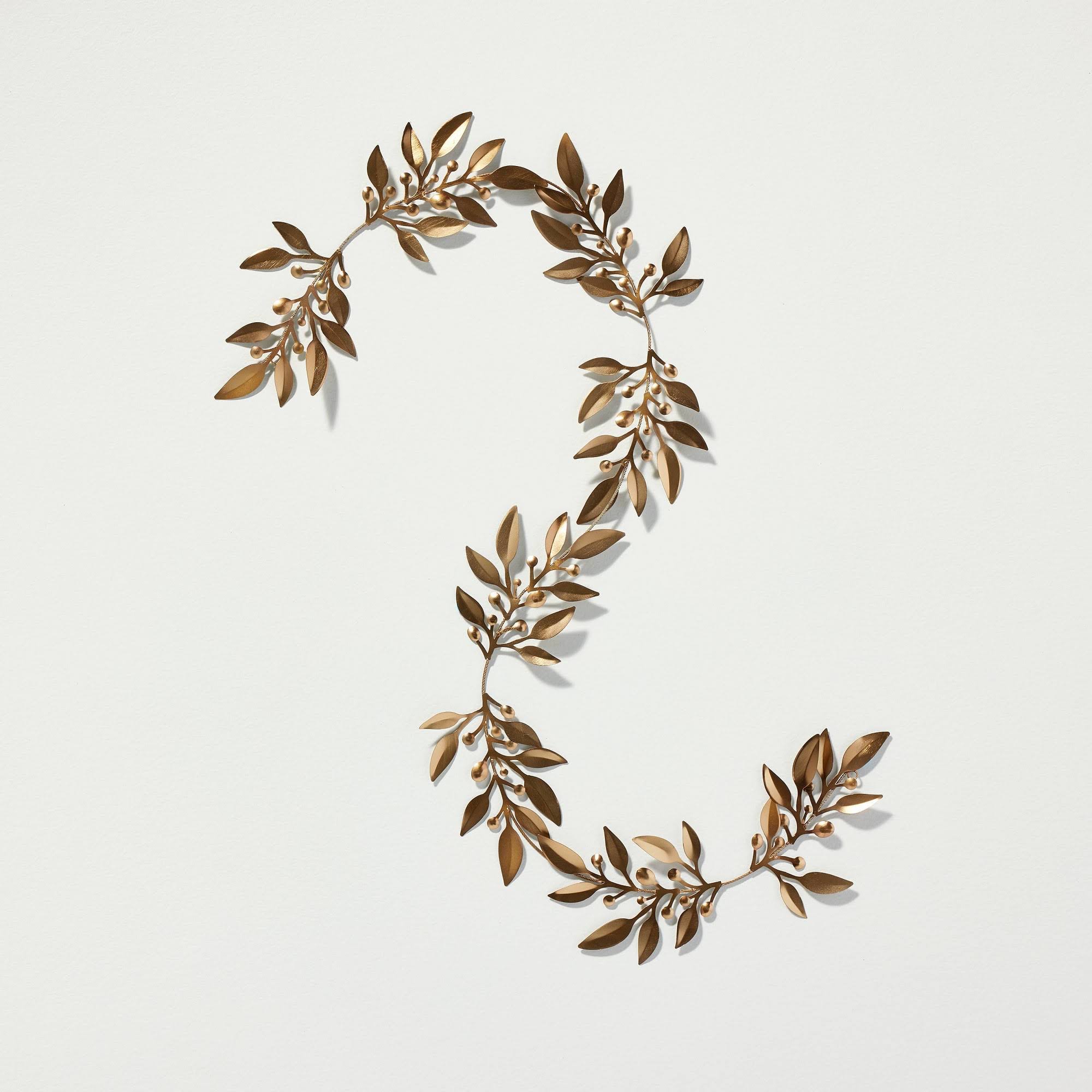 107053048eede9e492cfb213ab2b85a3ca6be0a7aaa48b863f5caa4ba032c747.jpg 5' Decorative Metal Leaf Christmas Garland Antique Brass - Hearth & Hand with Magnolia - Image 1