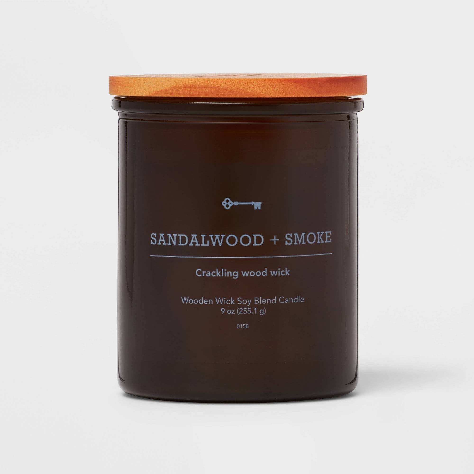 1b32ab60f3c3018113acf9e1e2da25881293162265a82aeac6851bfb46b0e6e0.jpg Threshold Lidded Amber Glass Jar Crackling Wooden Wick Sandalwood and Smoke Candle (9 oz) | Target - Image 1