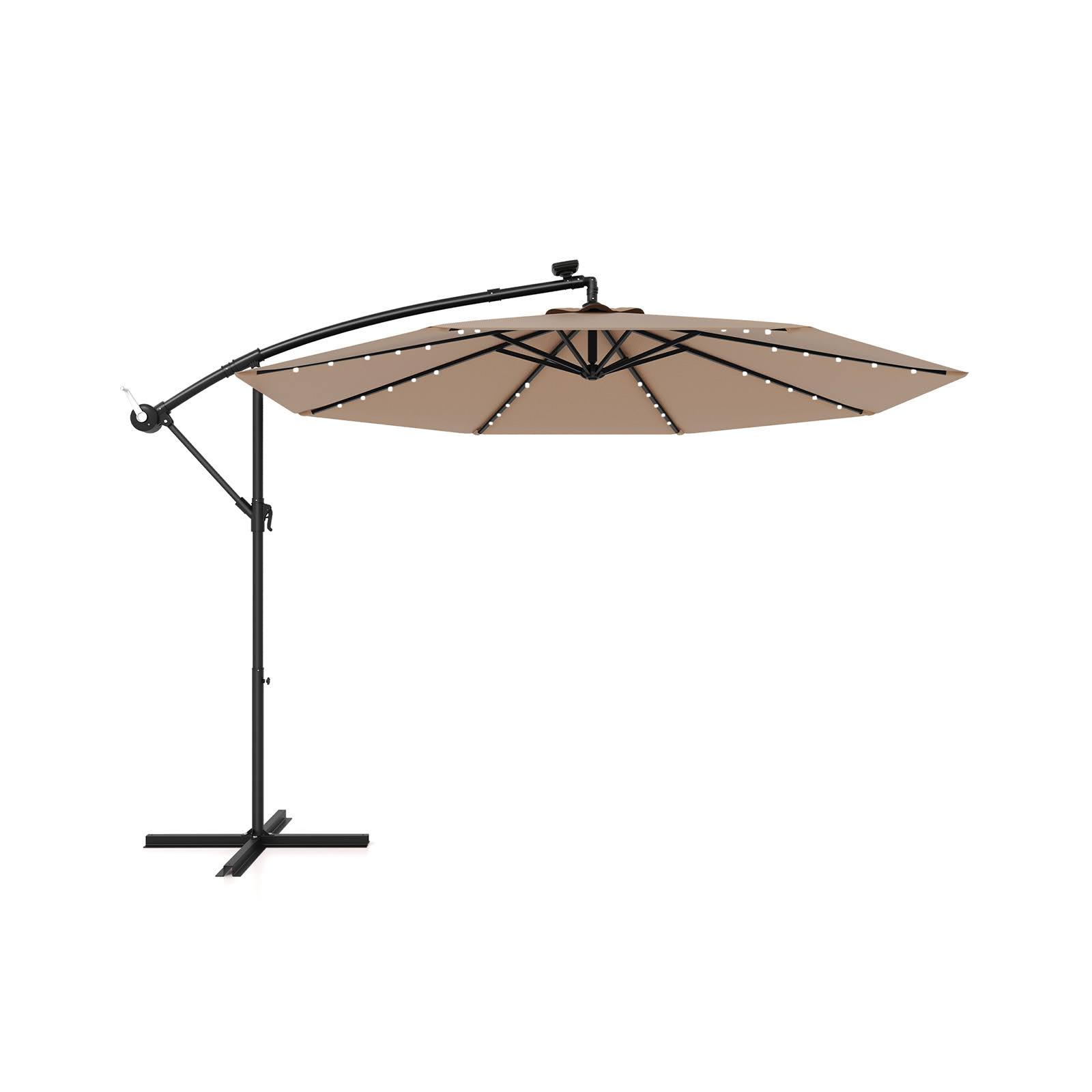1d3ec473204314fb204511fc75534a475f6299ec19ab2ff46d5aa7e4510b3483.jpg 10 ft Patio Solar LED Offset Umbrella with 40 Lights and Cross Base-Tan - Image 1