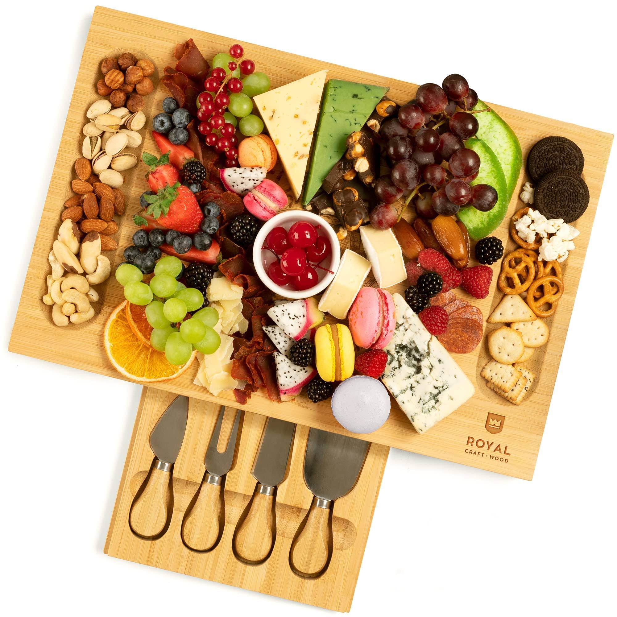 1e698f911daad945e1a71b0656c805bf7ea55f051174f6b65811c7aff4511ec8.jpg Royal Craft Wood Unique Bamboo Cheese Board Charcuterie Platter & Serving Tray Including 4 Stainless Steel Knife & Thick Wooden Server - Fancy - Image 1