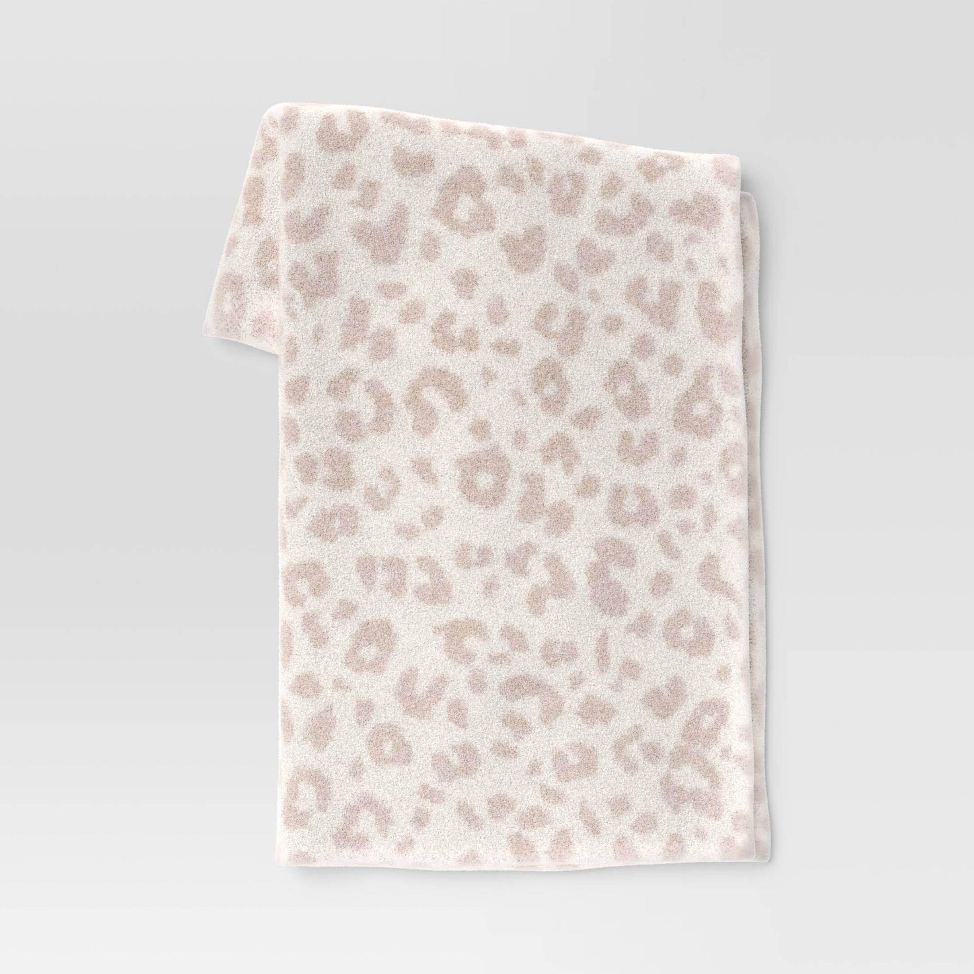 2721981d1cc5c07aba4f3faba1a17851b67bbc1f652fe8bb7a45c71220128d18-1.jpg Cozy Feathery Knit Cheetah Throw Blanket Beige - Threshold - Image 1