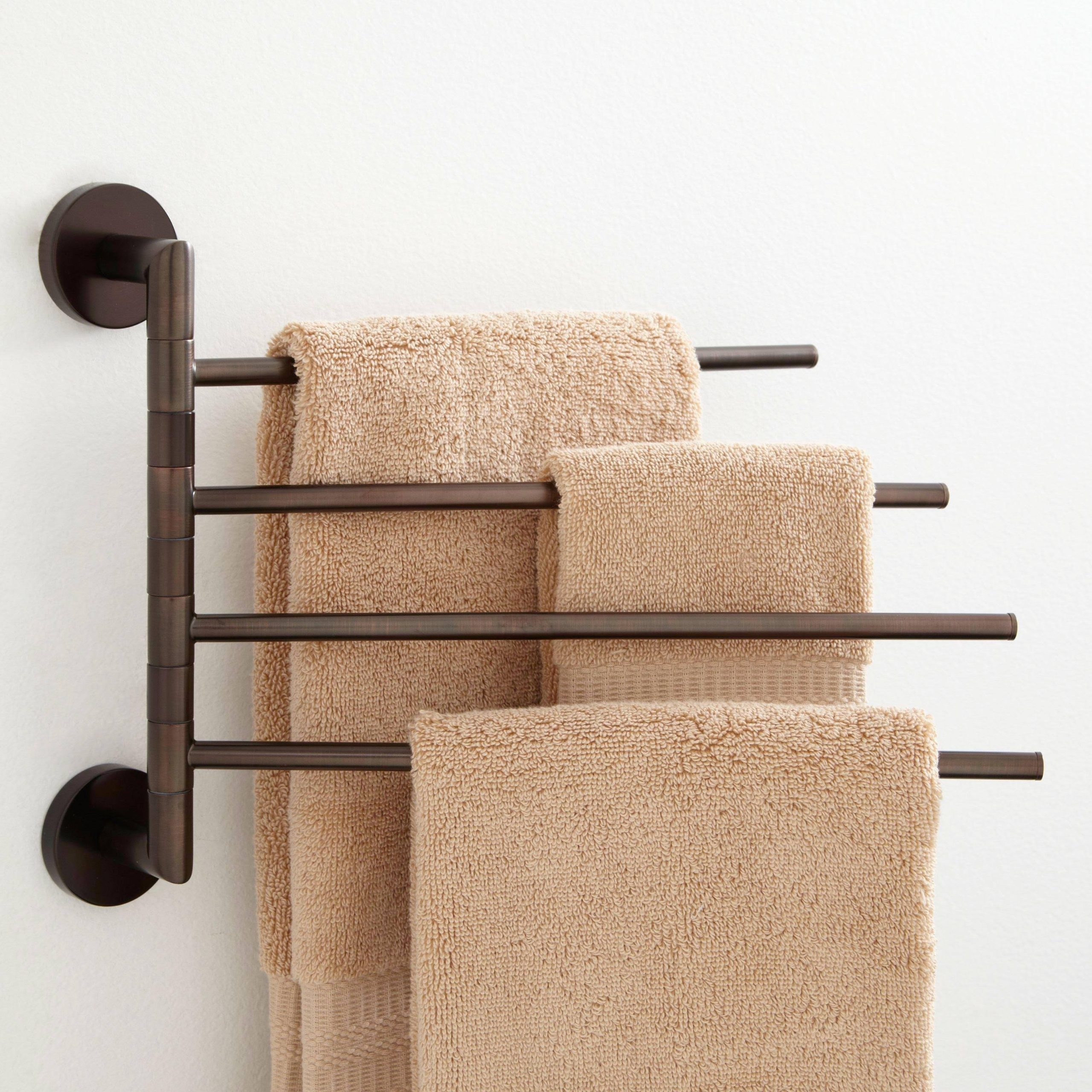 27acf708e368e4f0ec109244c852cd81a132773fdc7eb43317abd98cc60c20f9.jpg Signature Hardware 921736 Colvin Four Swing Arm Brass Towel Bar - Image 1