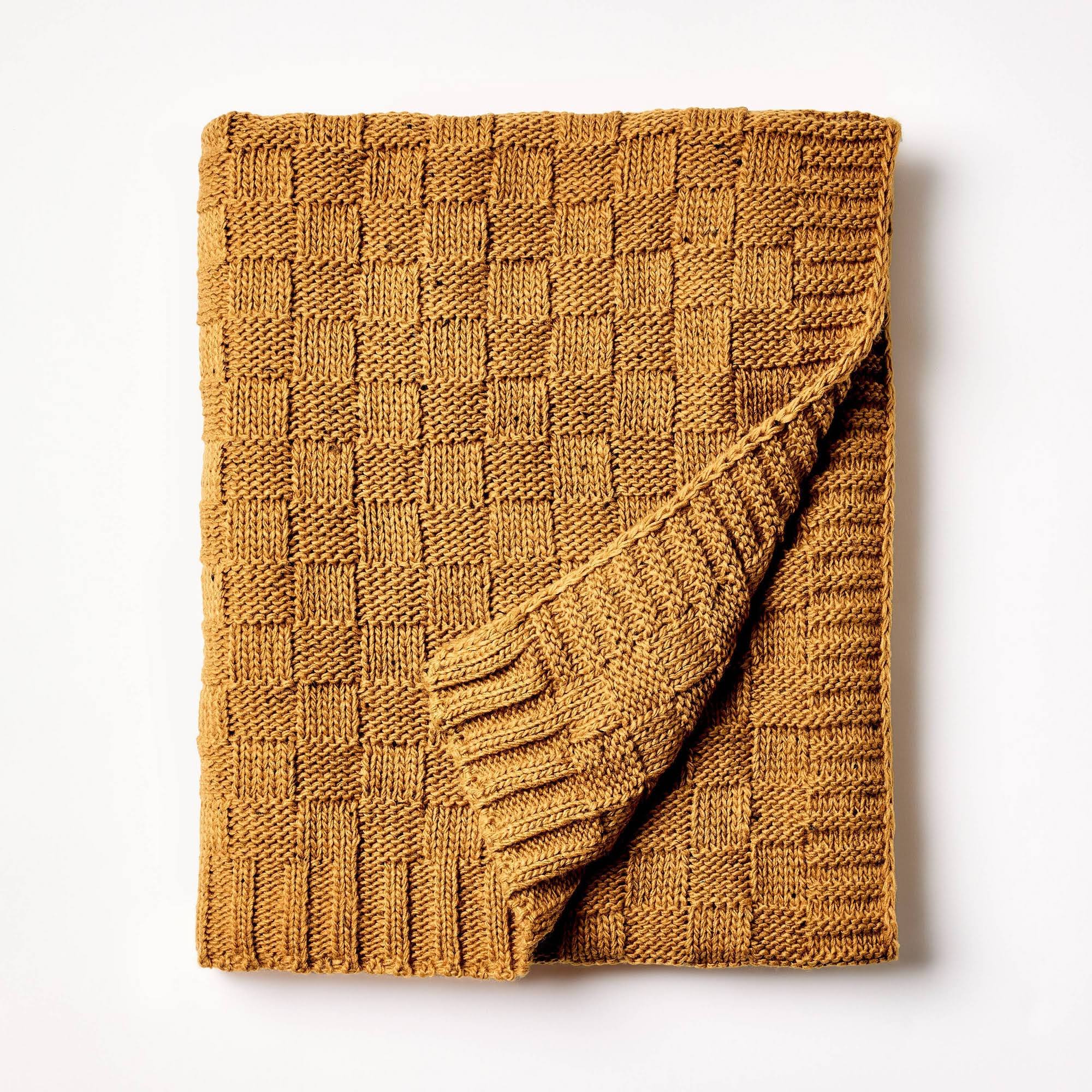 2d5cff2030facc02a20a4c24acd99d30f5265219033655ebdb9e7a3bc8f35f55.jpg Checkered Knit with Neps Throw Blanket Dark Tan - Threshold Designed with Studio McGee - Image 1