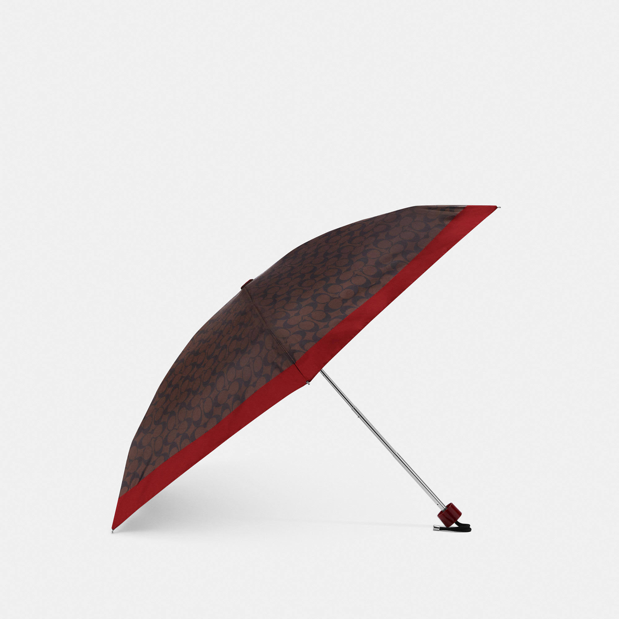 2d923710359e6cb6b7e3759b790f7cdc76cd7ebfc897e75e356bd23035c492f0.jpg Coach Outlet UV Protection Signature Mini Umbrella - Red - Image 1