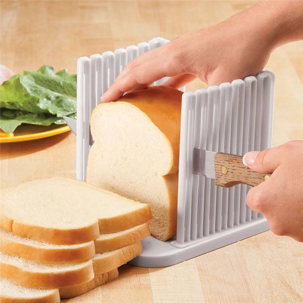 2fbca244f2201ff91a3ee18e4db0054b6e390316fd15c477ed5de8058fae7aa5.jpg Orione Adjustable Toast Slicer/ Cutting Guide for Homemade Bread Plastic Bread Slicer Loaf for Slicing Bread Foldable Kitchen Baking Tools (White) - Image 1