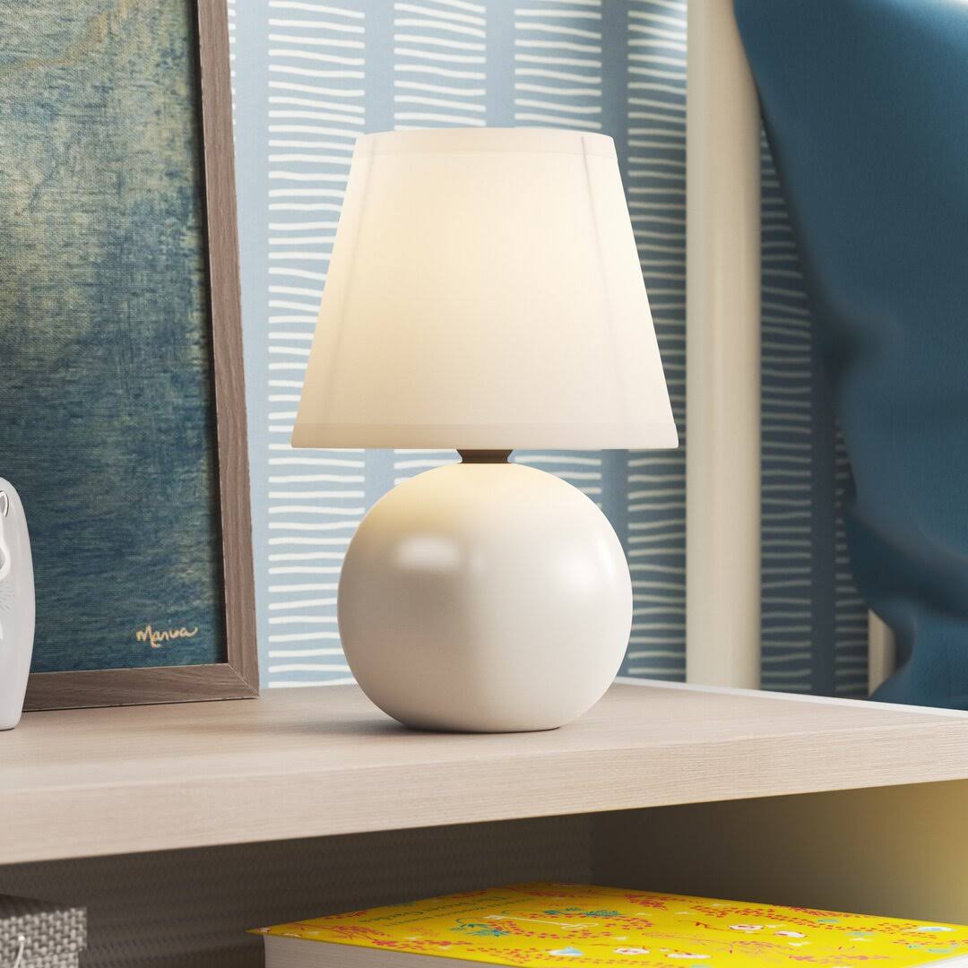 308b1004d7c3dd8e9d06ecc9b6cfacb32dfddb4b7dadf5d726a6b55c1d763246.jpg Adira Ceramic Globe Mini Table Lamp Mack & Milo Finish: Off White - Image 1