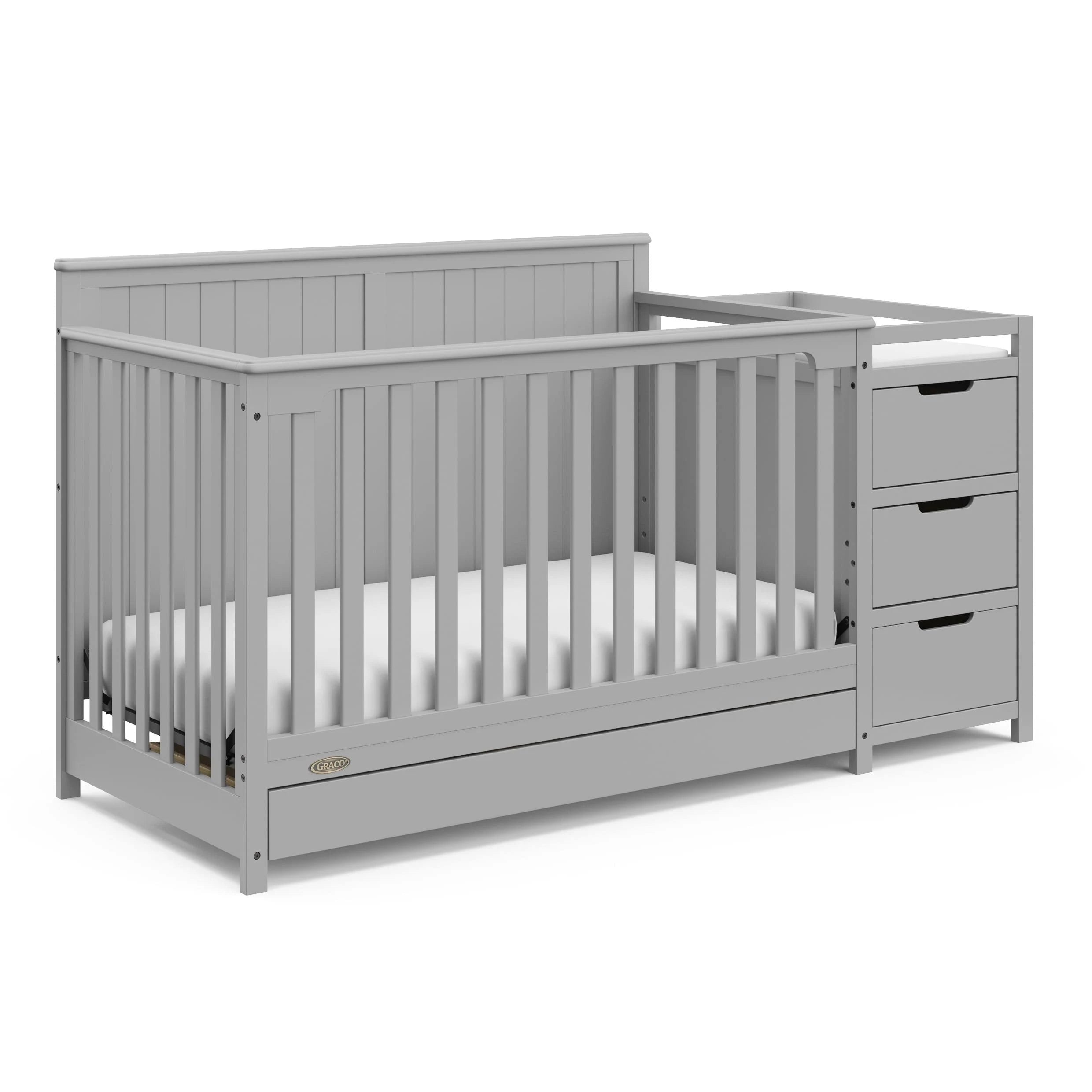 3125a278aef44bd61aeb2b2103f51c308bd7a0e37961416144d7ab9bc8dbe452.jpg Graco Hadley 5-in-1 Convertible Crib and Changer with Drawer Pebble G - MadeInUSA - Image 1