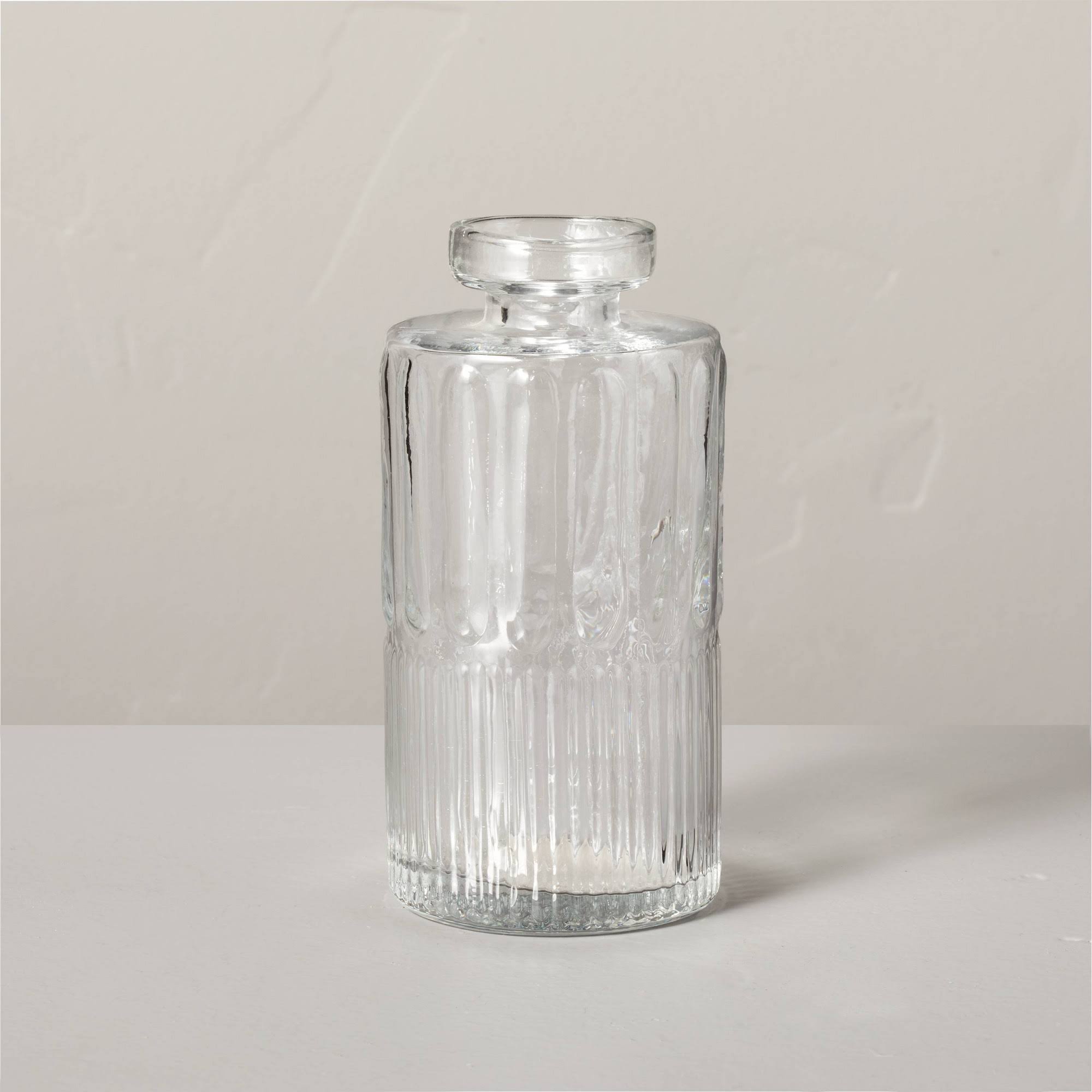 3e55093fe7bd079a5e6e92ff400b22458d64148c90fc039fe28bdf059426abe2.jpg Large Ribbed Clear Glass Bud Vase - Hearth & Hand with Magnolia - Image 1