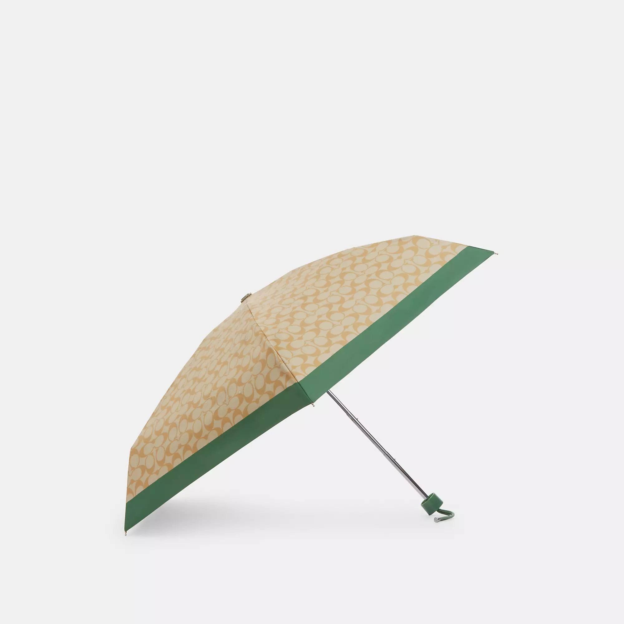 4e8c2bedc83fa928ee03c5375e1527eb6f52a4927685f52256ef87e109d97ed1.jpg Coach Outlet UV Protection Signature Mini Umbrella - Women's Accessories - Multi - Image 1