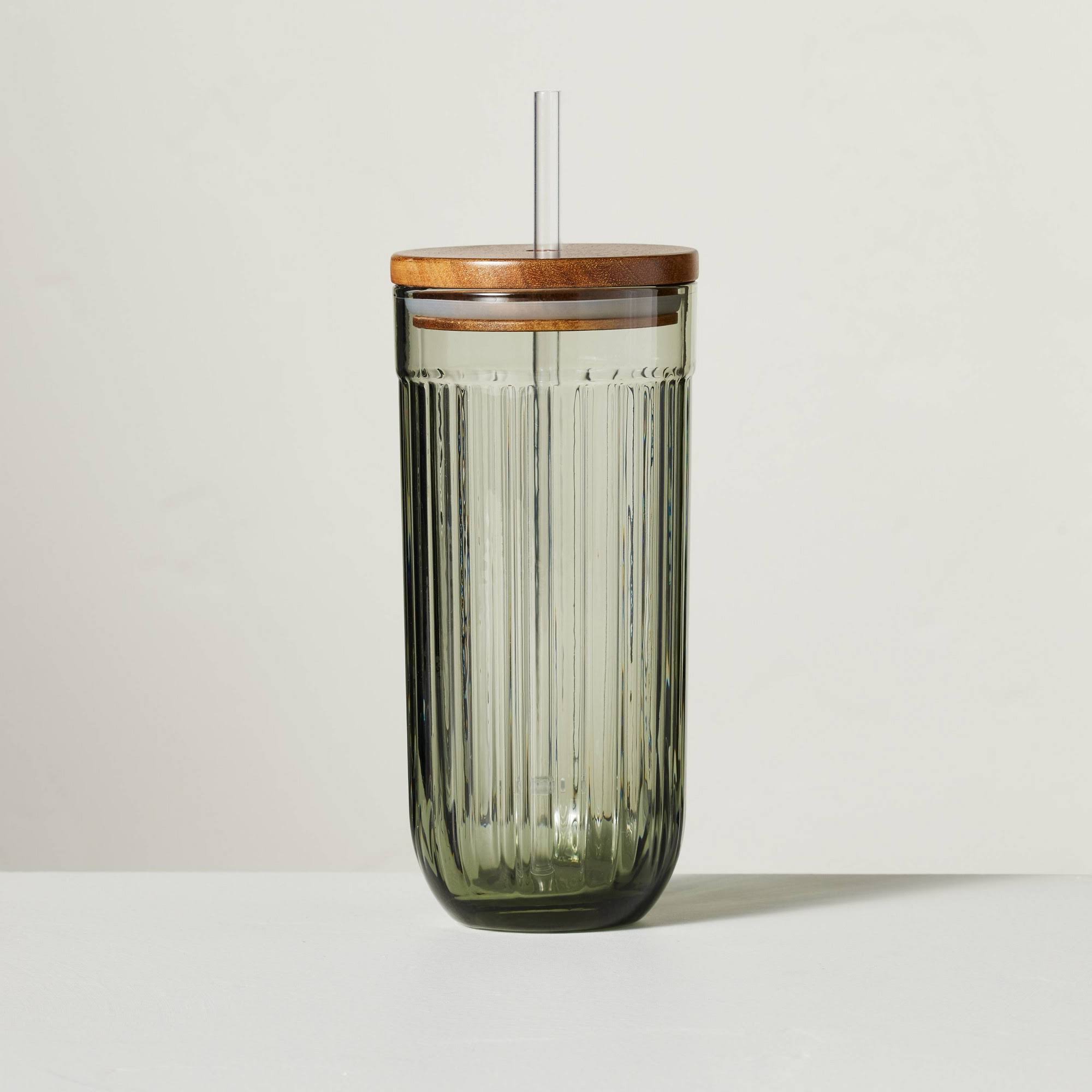 532121fe20087e0e9f15804b27a27cce74298ebd1ed1bb7f57e7ccf55c91e87a.jpg Hearth & Hand Dining | 21oz Fluted Glass Tumbler with Wood Lid Green - Hearth & Hand with Magnolia | Color: Green | Size: Os | Girlmeetskicks's Closet - Image 1