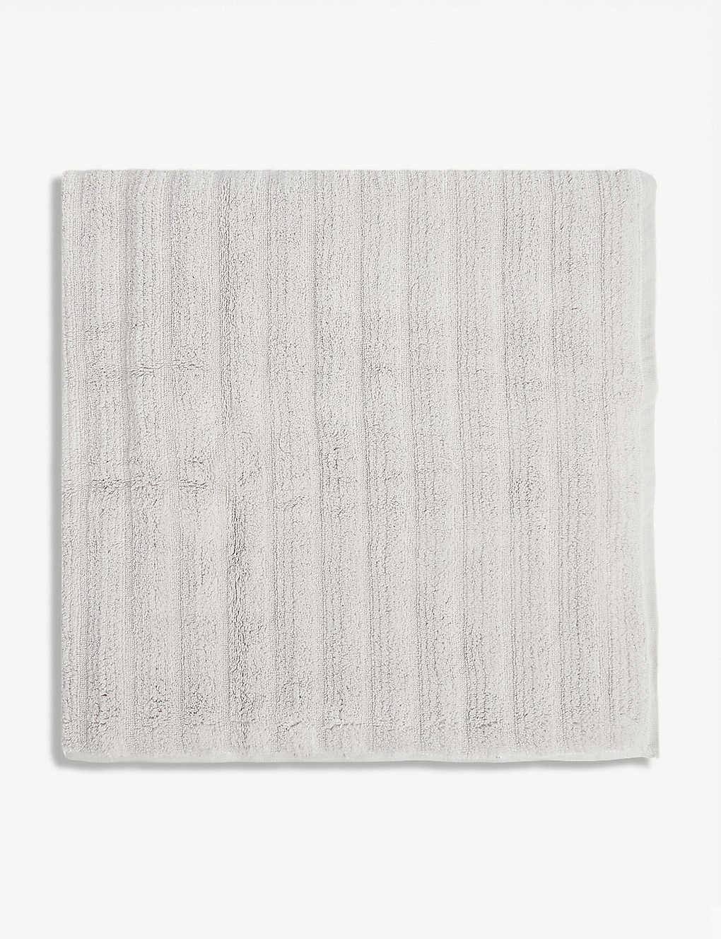 57d931595eed6cc16a4e2d1c21ae1eb3f6875aa932f4bccfec0fabbbee929850.jpg The White Company Ribbed Hydrocotton Bath Towel in Pearl Grey - Image 1