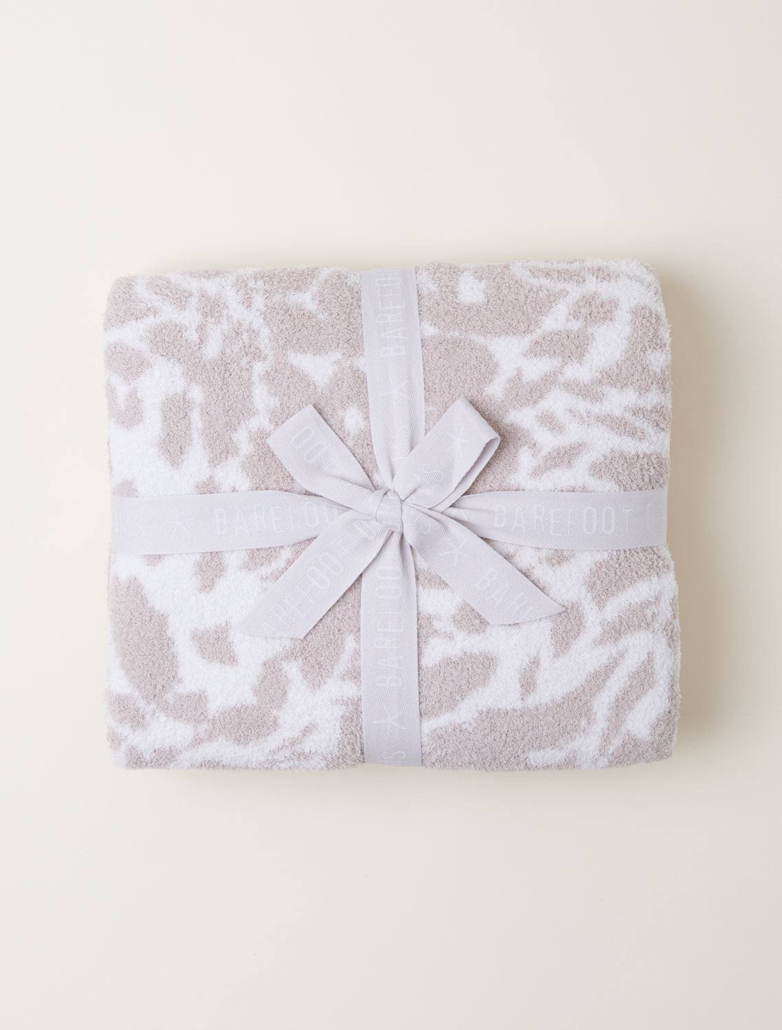 5c37d8d994bcaa97aa800638a39092254cf79b1c7fc97bf378ef365f8a9fd524-1.jpg Barefoot Dreams CozyChic Bloom Blanket - Cream Sand Dollar - Image 1