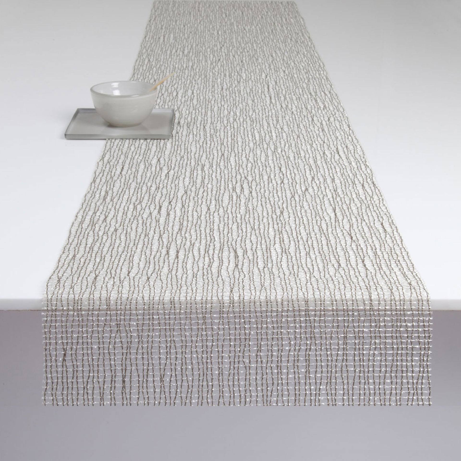 5f40ea5cafe582b3abaae3971875699b7d13fcf34c3ce14f7be7560a6c65ceed.jpg Chilewich Lattice Silver Table Runner, 14" x 72" - Image 1
