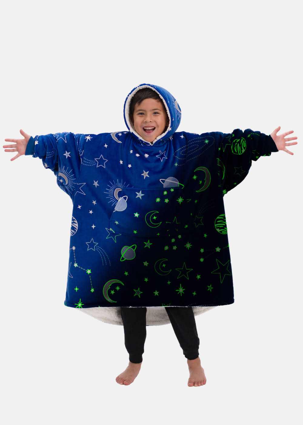 60de1c29e4bd74c0adb192e7bad66f571f6ea8434f39a13638b1bb880bdbb434.jpg The Comfy Original Jr., Glow in The Dark Microfiber & Sherpa Wearable Blanket for Kids w/ Hood & Pocket, Fits Ages 4-10, Blue Glow Outer Space - Image 1