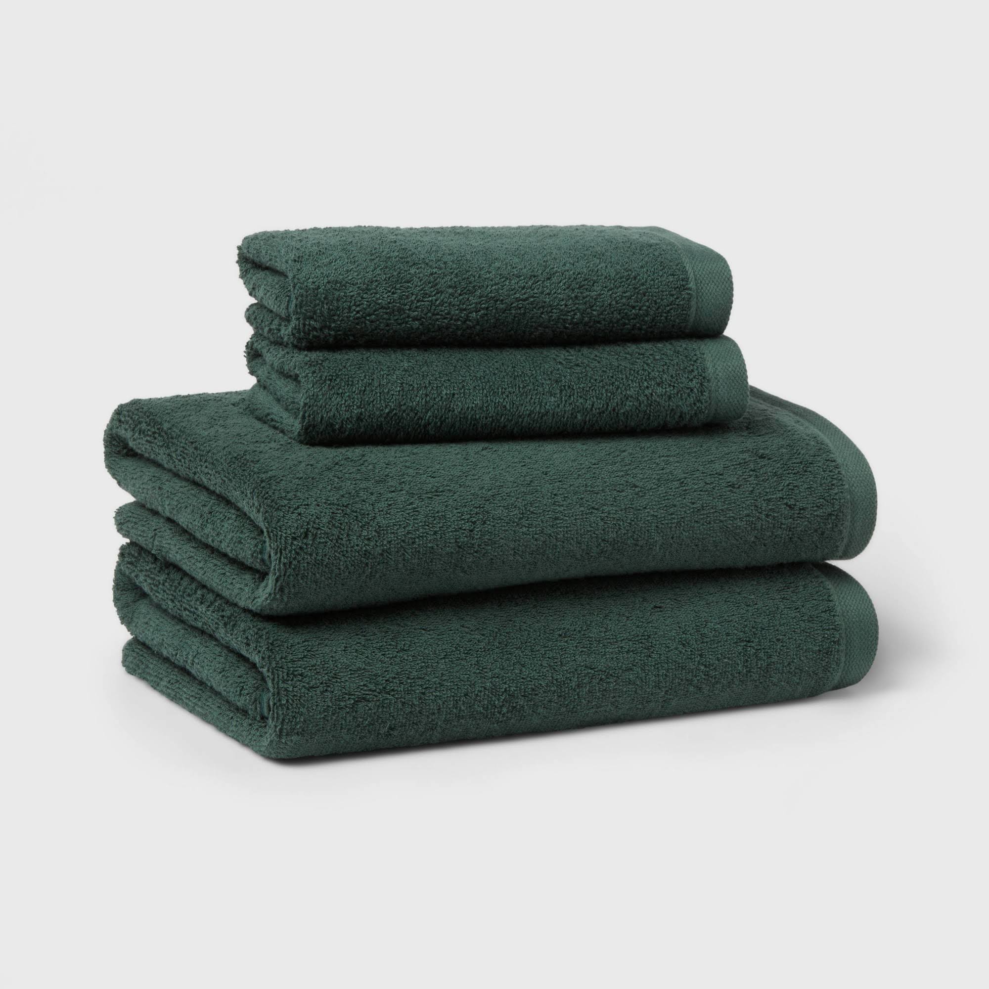 694e26dfd1372420fee882cd3a55ca3265e6cb535b6982b61c4085c3a1b85d9c.jpg 4pc Antimicrobial Assorted Bath and Hand Towel Set Dark Green - Room Essentials - Image 1