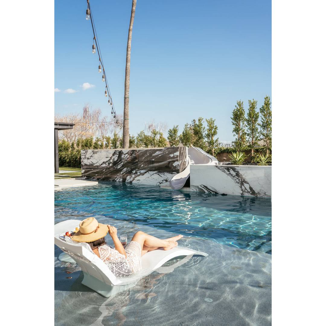 6b04c428bf413b9f81c53585886f7a1258826b8c1ae63497e65257994689a1e9.jpg Ledge Lounger Signiture Chaise Deep - White - Image 1