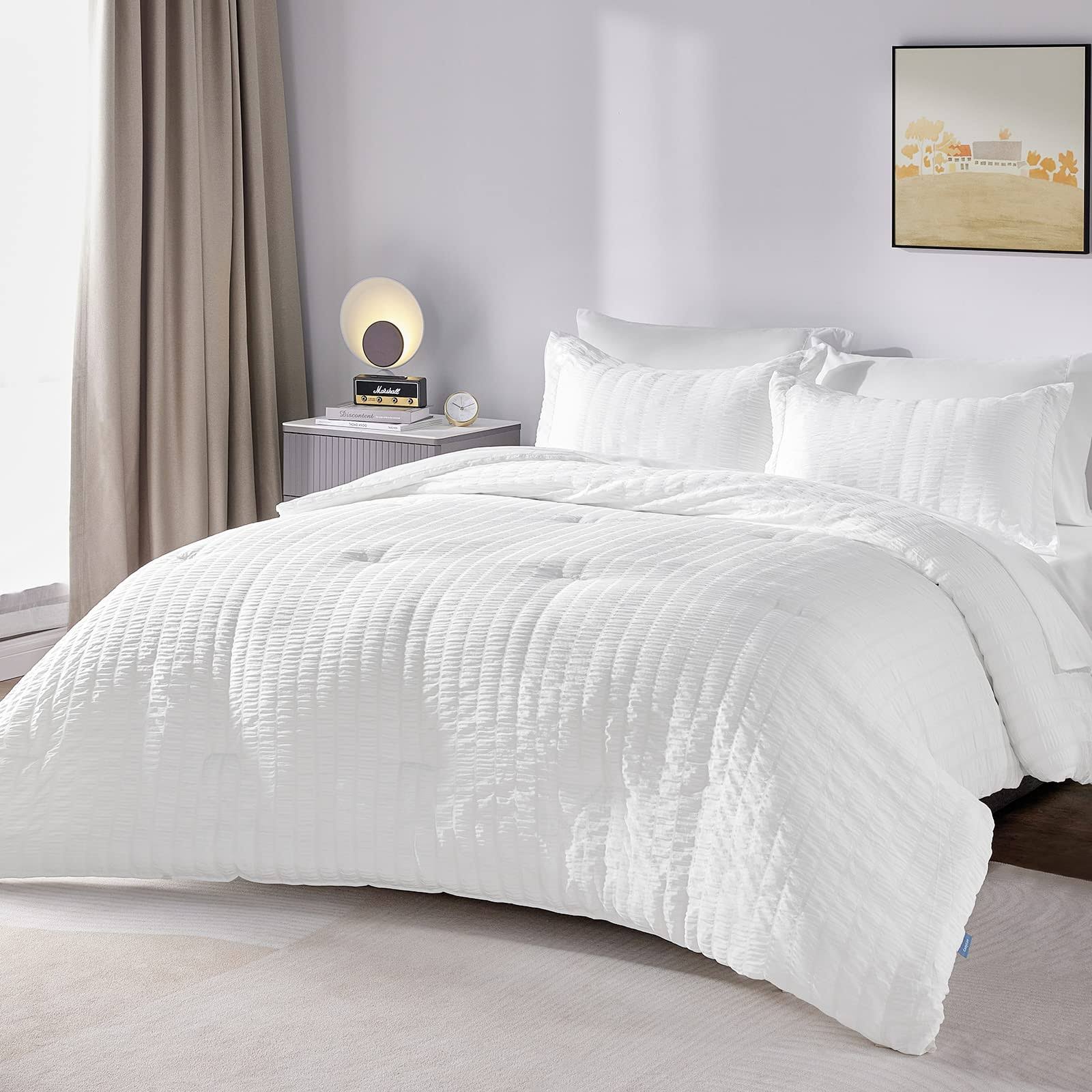 7126c75d9e034b625aee3699743342dbd620113bc519b9dbb8aa787d76c791b3.jpg CozyLux Queen Bed in A Bag White Seersucker Comforter Set with Sheets 7-Pieces All Season Bedding Sets with Comforter, Pillow Sham, Flat Sheet, Fitted - Image 1