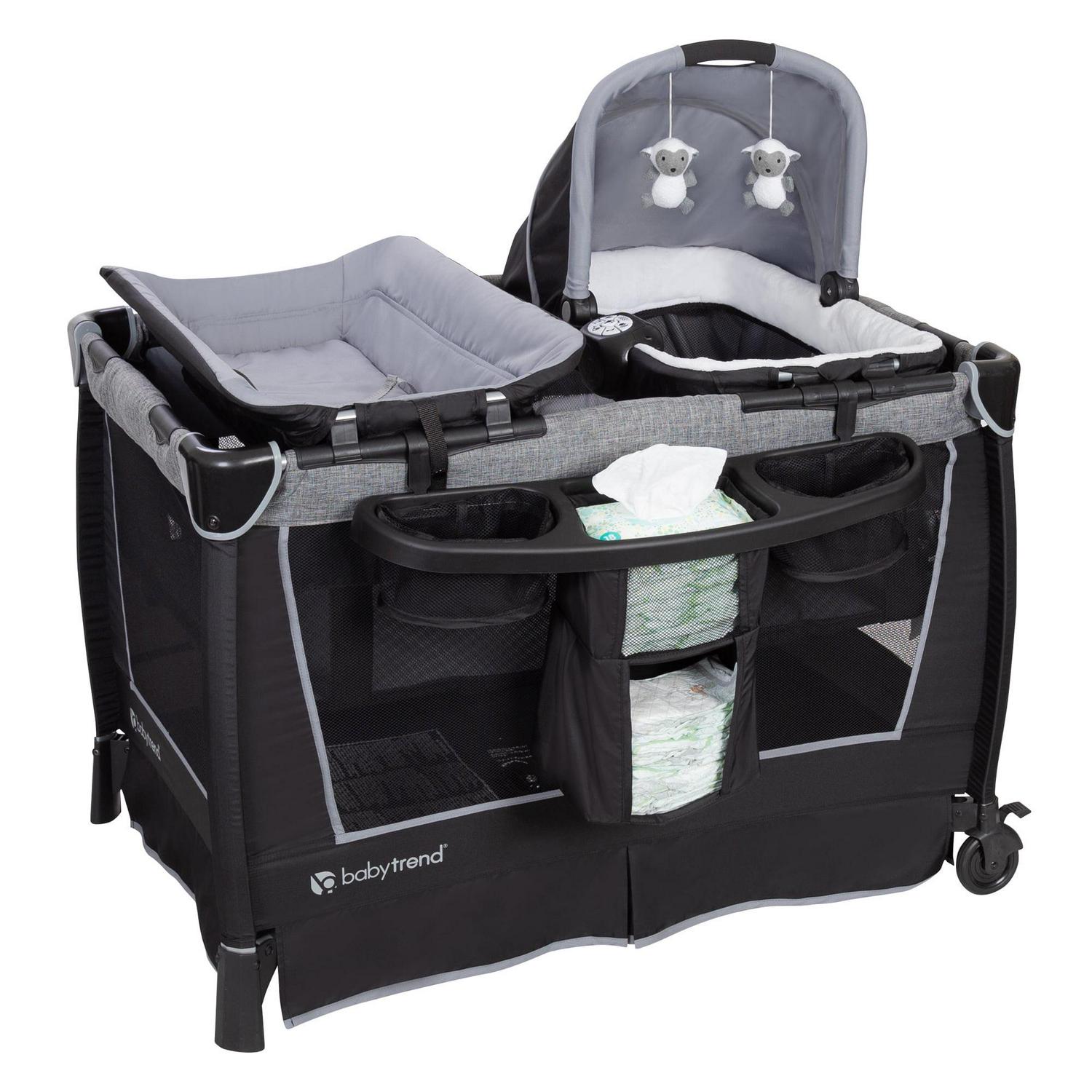 768ab96824272858f6e2141ec3f460f5070be1bd896af4d7e4606e5ba10fa39c.jpg Baby Trend Simply Smart Nursery Center Playard with Bassinet and Travel Bag - Whisper Grey - Image 1