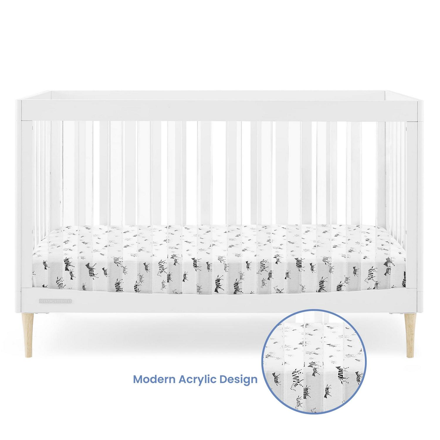 773ba84e1784397c6f8dfc28e23ff488cccb7b9d5a5f79c69d9857777d8c56b6.jpg Delta Children Austin Acrylic 4 - in - 1 Convertible Baby Crib - Greenguard Gold Certified. Bianca White/Natural - Image 1