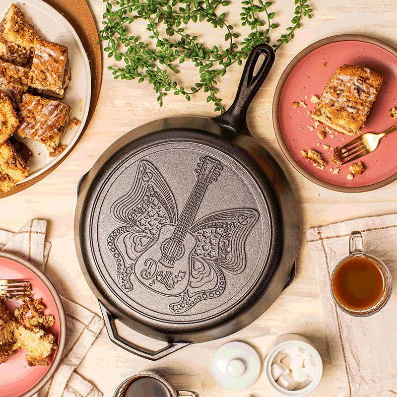 7a0b411665d503d302db6e395aec1c77ec383a59ab6f7a58c8b57c8d750a6ca1.jpg Dolly Parton | Clear Blue Morning Skillet | Size: 13.25 Inches | Lodge Cast Iron - Image 1
