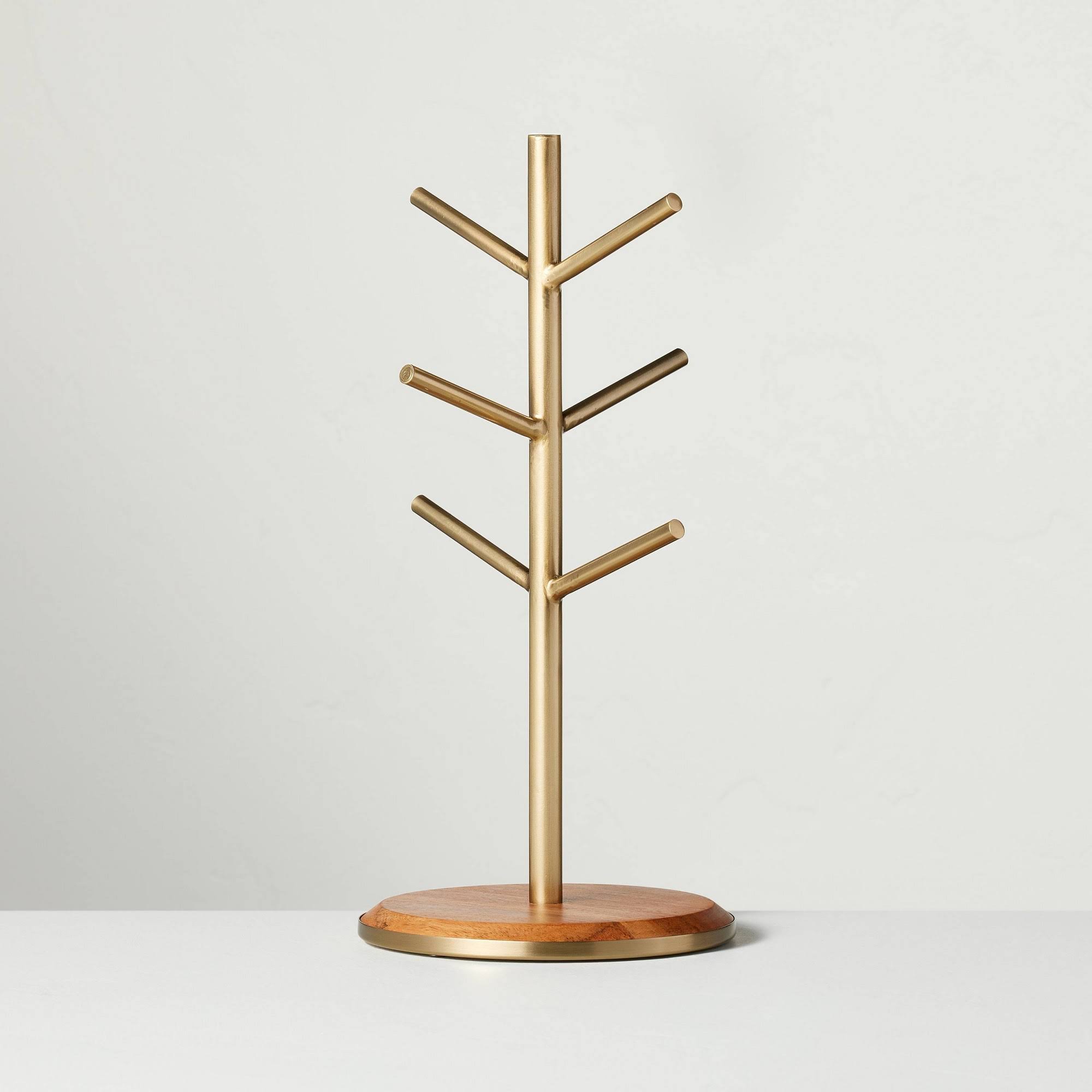 8ad3e5516c15de436bb5638cab2bca470ca2f4d2c3943b638eaf363bdaa94881.jpg Hearth & Hand with Magnolia Wood & Brass Mug Tree | Target - Image 1