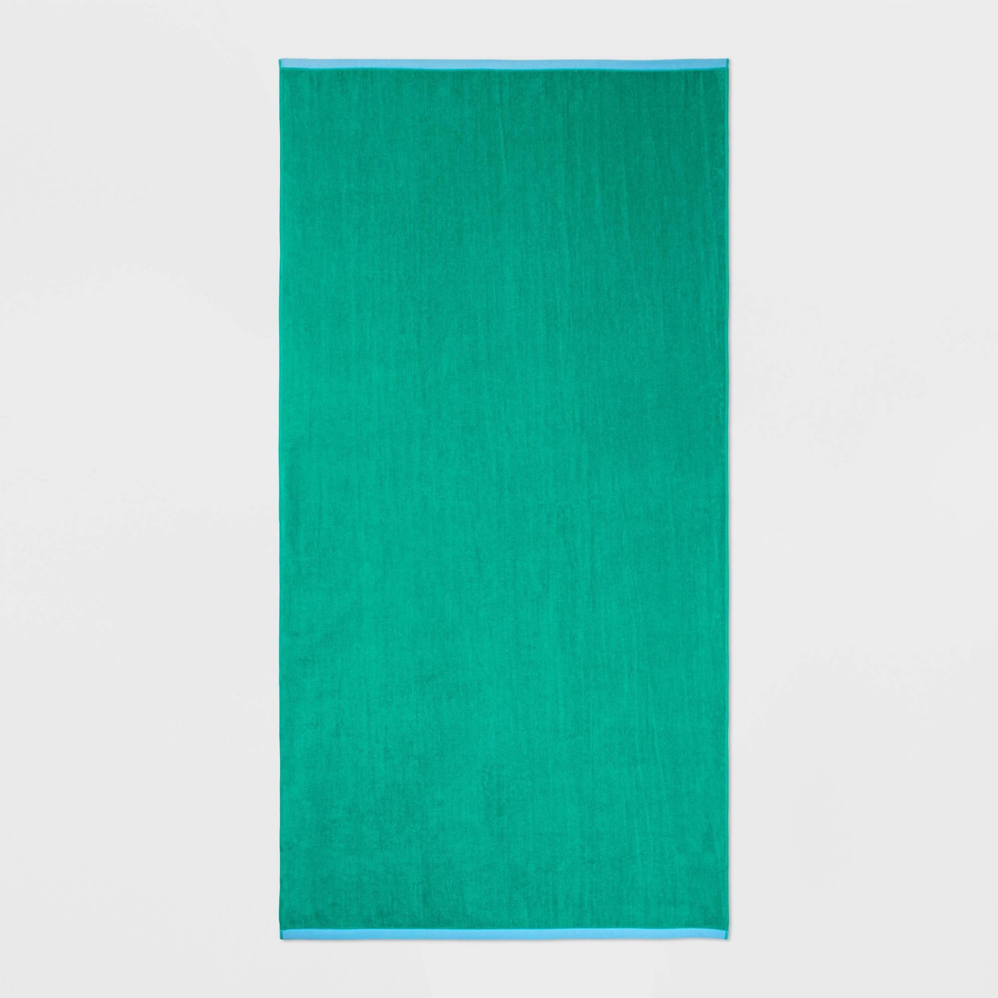 8c554d7eb3b386a29bb8e300418813458af87114f0fa2ecba4a31d48f33975af.jpg Wow Reversible Towel Green - Sun Squad - Image 1