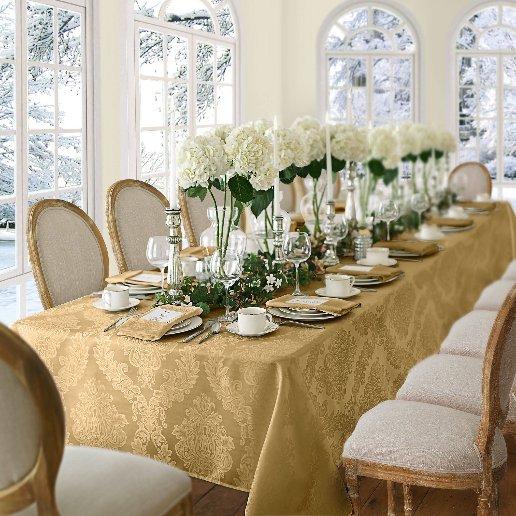8cd069e466824c0f55089b362bfa5ccde595186f9cfb097b5f42953caaabc62e.jpg Elrene Barcelona Damask 60" x 84" Oblong Tablecloth - Gold - Image 1