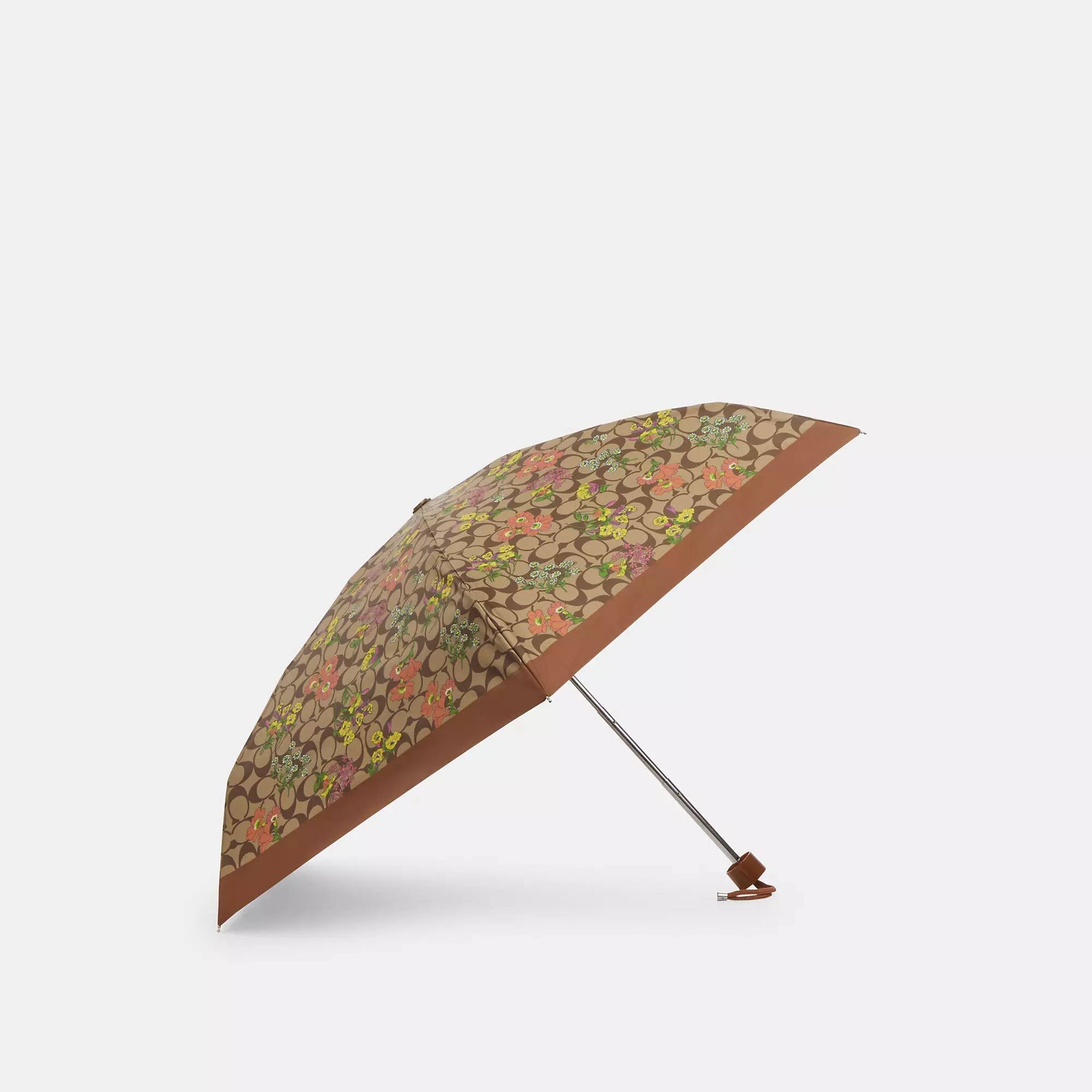 8eada43257126712f6af73d0c1810e158b08e2e4b1c0757fdc03bf93792430fe.jpg Coach Outlet Mini Umbrella in Signature Floral Print - Gold/Khaki Multi - Image 1