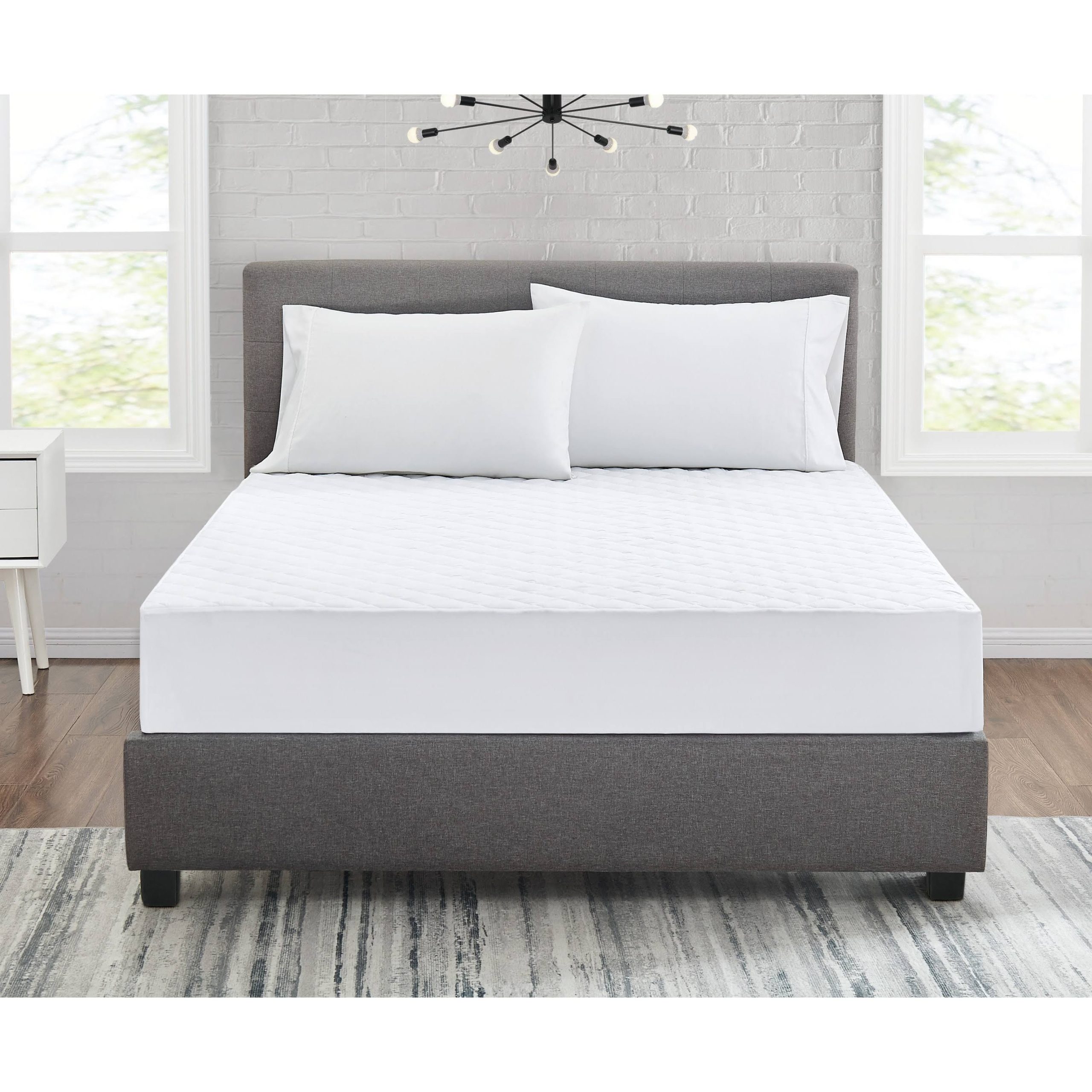 8ee9903cb21af879e6e034b593e4096cfee0ff666e649b07244d4749ae2ccc45.jpg Truly Calm Silver Cool Mattress Pad, White, Twin - Image 1