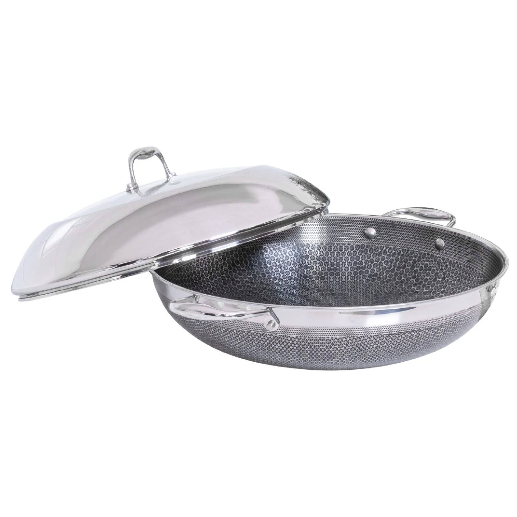 91b21958ef569f05ee2da5902c5f9687b21a65e7924f0ae15eed40b4a5ef80e0.jpg HexClad 14 inch Hybrid Stainless Steel Wok Pan with Stay-Cool Handle - Image 1