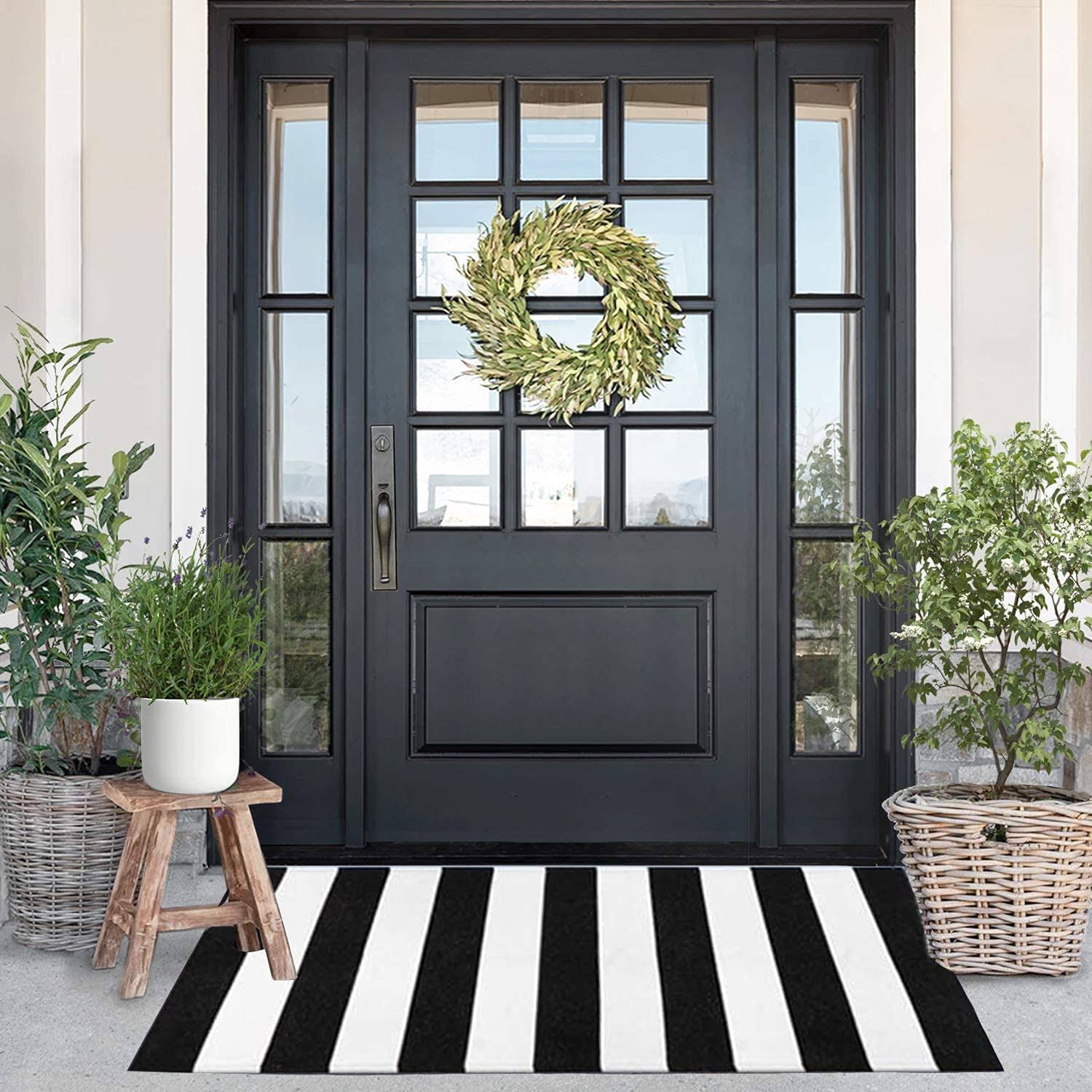 953a2919612727c4e7e34c038c450b017c31bf763e69984f747f506f3d519626.jpg Kahouen Black and White Striped Rug (23.6 x 51.2 Inches), Striped Layering Mats, Handmade Woven Indoor Outdoor Doormats Striped Rug for Kitchen - Image 1