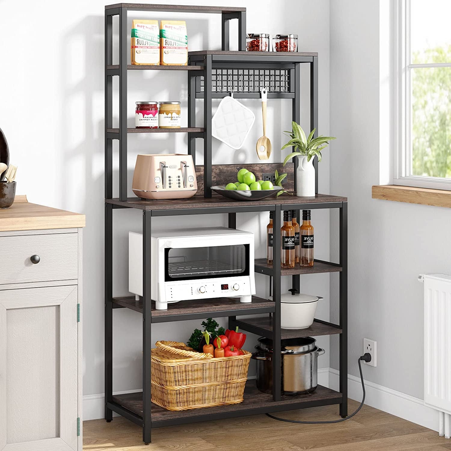 96e4fa871d36a1cd45df9531f8379b12f4201d7609d6cfbeaf9266fd61c78702.jpg Bakers Rack with Power Outlet. 9-Tier Microwave Stand with Hutch. Kitchen Utility Storage Shelf with 8 S-Hooks. Industrial Coffee Bar Station for Living Room - Rustic Brown - Image 1