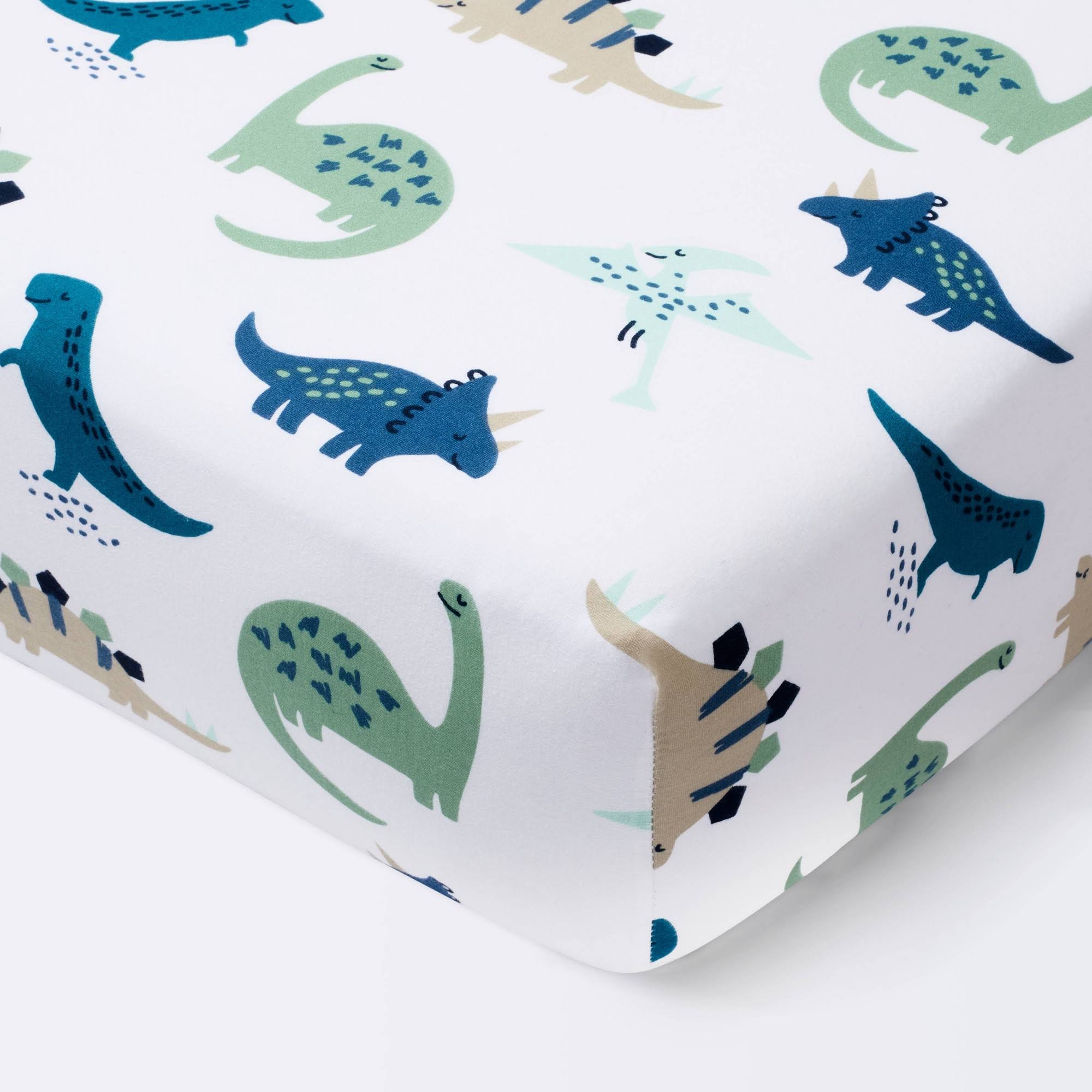 9e0aa2088289bfdd8423ac097c08d71d326653ce2569b36830e5aec6d4ee323b.jpg Cloud Island Dinos Cool Blue Green Fitted Crib Sheet | Target - Image 1