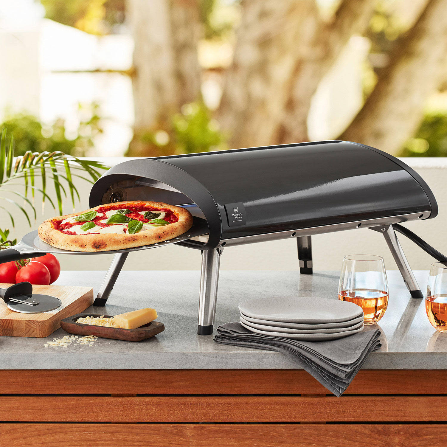 9e688db16fbb69187a3f353fbcd03a545655f24b5b833ed1ea718aef8c48497e.jpg Member's Mark 12" Portable Gas Pizza Oven Black - Image 1