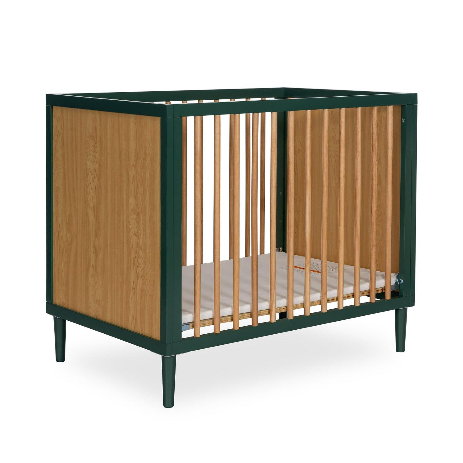 a598187d989d0bf53039997c90d97b4e6fd29de3e8f1d8fa0b8c1a560880a5d7.jpg Dream on Me Lucas Mini Modern Crib with Rounded Spindles I Convertible Crib I Mid - Century Meets Modern I Portable Crib - Image 1