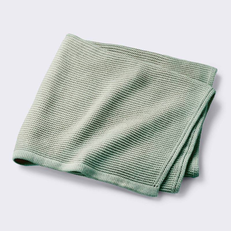aa55df522835628fd457384f41aaf4f0d211ec30a4a507ef5498b9f63a4fec1a.jpg Knit Baby Blanket - Green - Cloud Island - Image 1