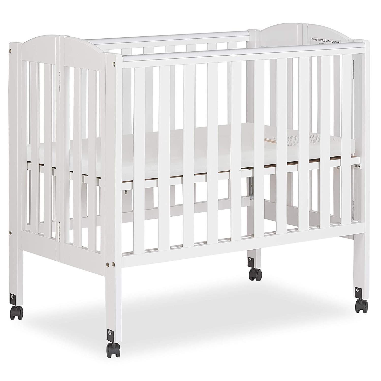 aaad9067fdf4804abe123f98413754231937de860919dd824007985751db841e.jpg Dream on Me 2 - in - 1 Folding Portable Mini Crib in White. Mattress Pad Included. Easy to Fold and Store Baby Crib. Two Adjustable Mattress Height Positions Convertible Crib - Image 1