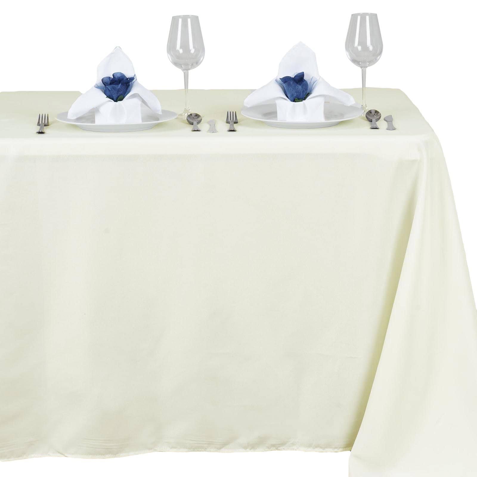 b1b2658f6a2cef66df7956b7fc8c2d3f0492ed666ffa926d2054da1fd54d107f.jpg Efavormart 54X96 Ivory Wholesale Linens Polyester Tablecloths Rectangle Banquet Linen Wedding Party Restaurant Tablecloth - Image 1