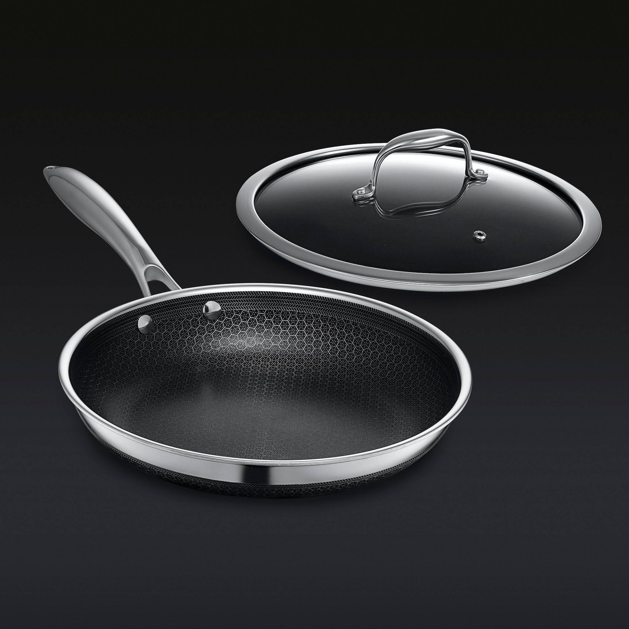 b5ca942b3ad3e90e24c54e151c775f30b87a03fe51389a76db3a4126ad749a9a.jpg HexClad 10 inch Hybrid Stainless Steel Frying Pan with Glass Lid, Nonstick - Image 1