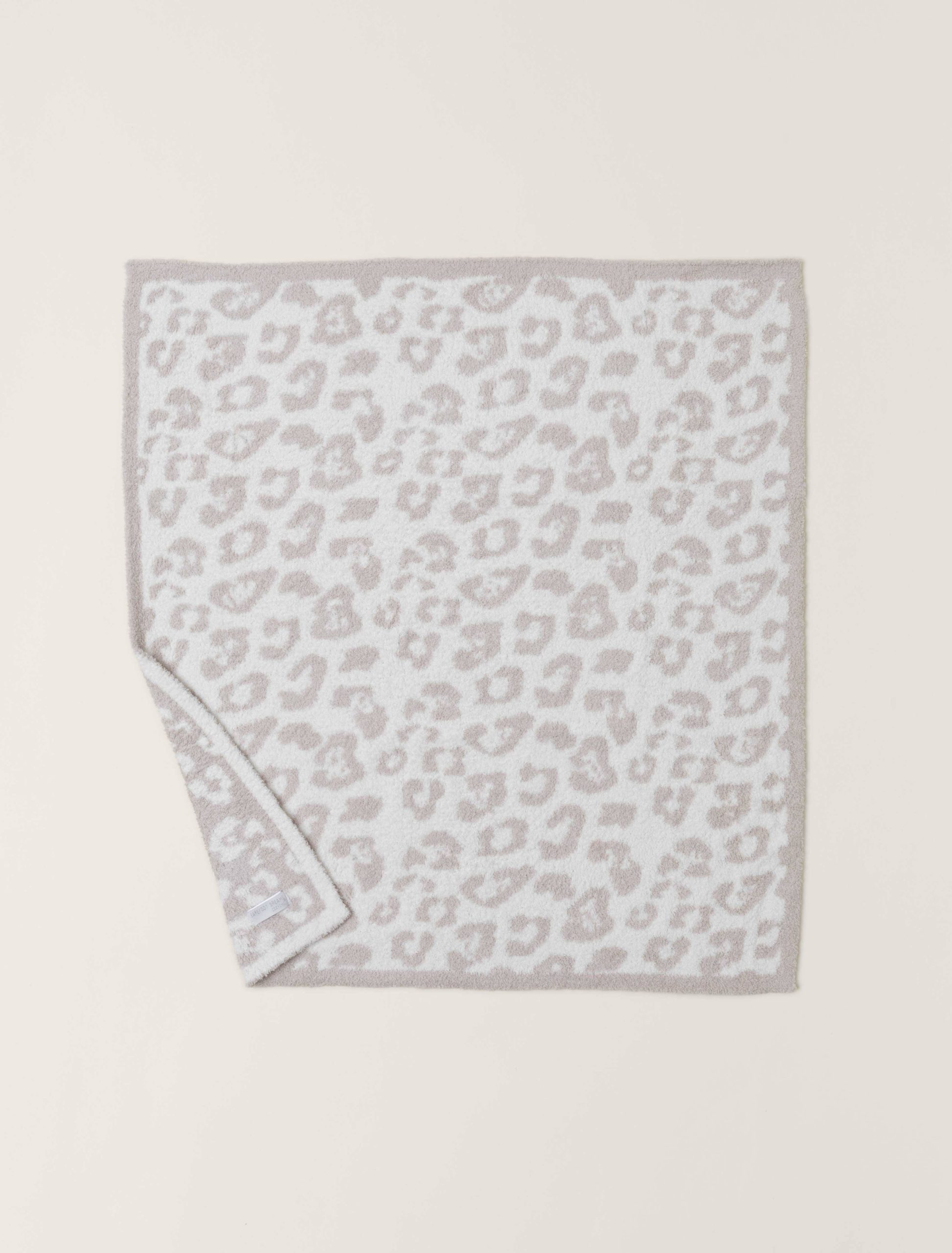 ba89a2944f49ef5a6155dc5a05e9752787f44e90f06a1ac1afa0a093c12bc066.jpg Barefoot Dreams CozyChic Barefoot in The Wild Baby Blanket - Stone / Cream - Image 1