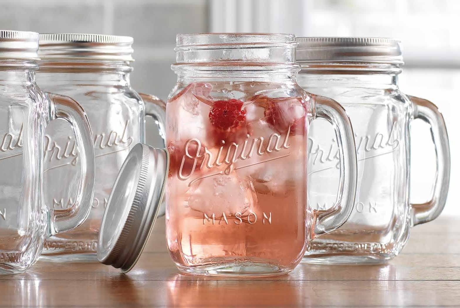 bd30acf5e587a6324acfaa8ea057aa96a7bd381670e6b8e34c1d1ad03aaf9fb3.jpg Glaver's Mason Jar 16 oz Glass Mugs with Handle and Lid Set of 4 - Home Essentials Beyond - Old Fashioned Drinking Glass Bottles Origina - Image 1