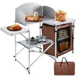 Camping Kitchen Station. Aluminum Portable Folding Camp Cook Table with Windshield. Storage Organizer and 4 Adjustable Feet. Quick Installation for Outdoor Picnic Beach Party Cooking. Brown