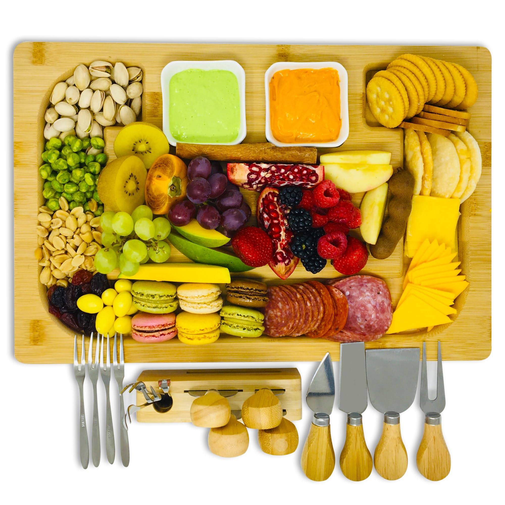 e64bb78c1e86f483cd4390ab794b53de82da0f240c81e5b38c197f0a15556b47.jpg Charcuterie Cheese Board Set with Bonus Knives, Bowls, and Forks ÿ Reversible Extra Large Bamboo Board & Serving Tray with Deep Grooves and Easy - Image 1
