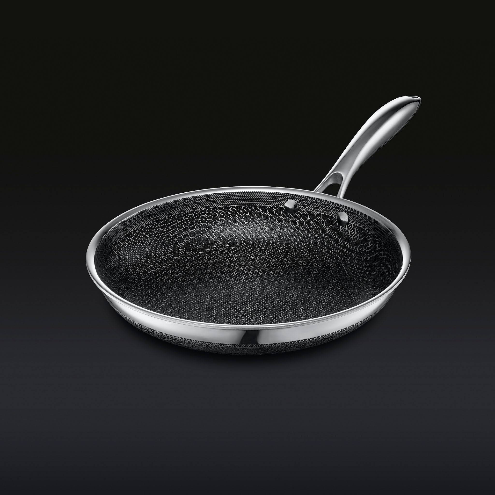 ea9004cb8f62bb476f19b6bc368c5e1d41d247dad62c42f2e9ffd1c77c57ec94.jpg HexClad Hybrid Stainless/Nonstick Inside and Out Commercial Cookware Fry Pan 10-Inch - Image 1