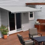 Aleko 10x8 ft Retractable Motorized Patio Awning Grey/White Stripe