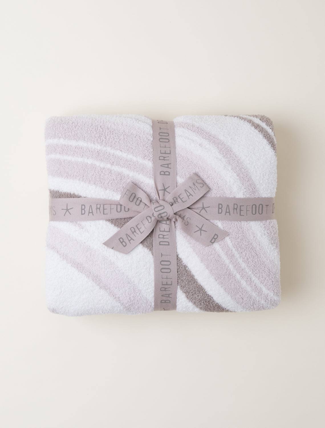 f32ca5b7aaf9d7c01df14d1dc0174517a99f83e14b21a593b990a50516d8f9f4.jpg Barefoot Dreams CozyChic Marbled Blanket - Sand Multi - Image 1