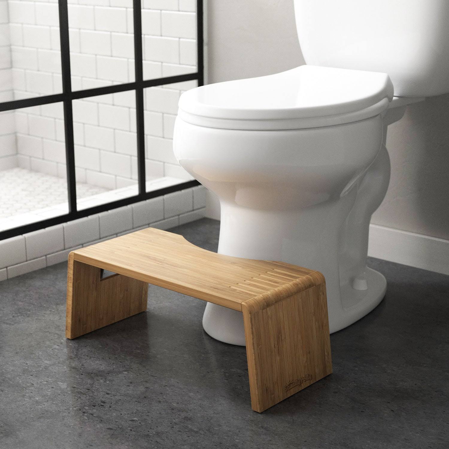 f34b24a777ca8e49f50d869212242f341d0a0836af18711890e12115c9a0cbfc.jpg Squatty Potty Oslo Folding Bamboo Toilet Stool 7" Collapsible, Brown - Image 1