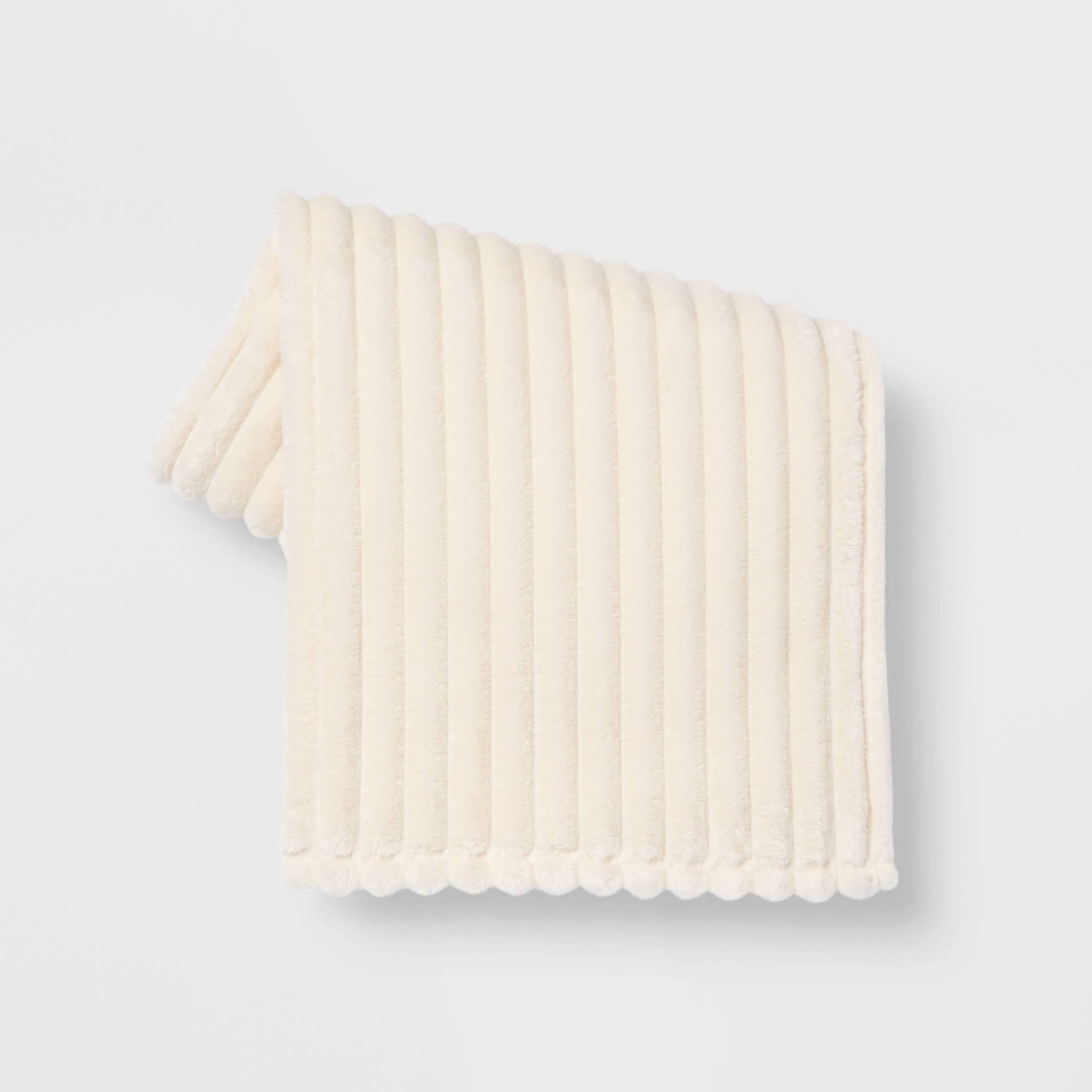 f53b04b17b5adcda04acd1198bb9a677c55c3a8eea4b0405031a510b5f407ce9.jpg Room Essentials Ribbed Plush Throw Blanket White 60 x 50 - Boyd Bros - Image 1